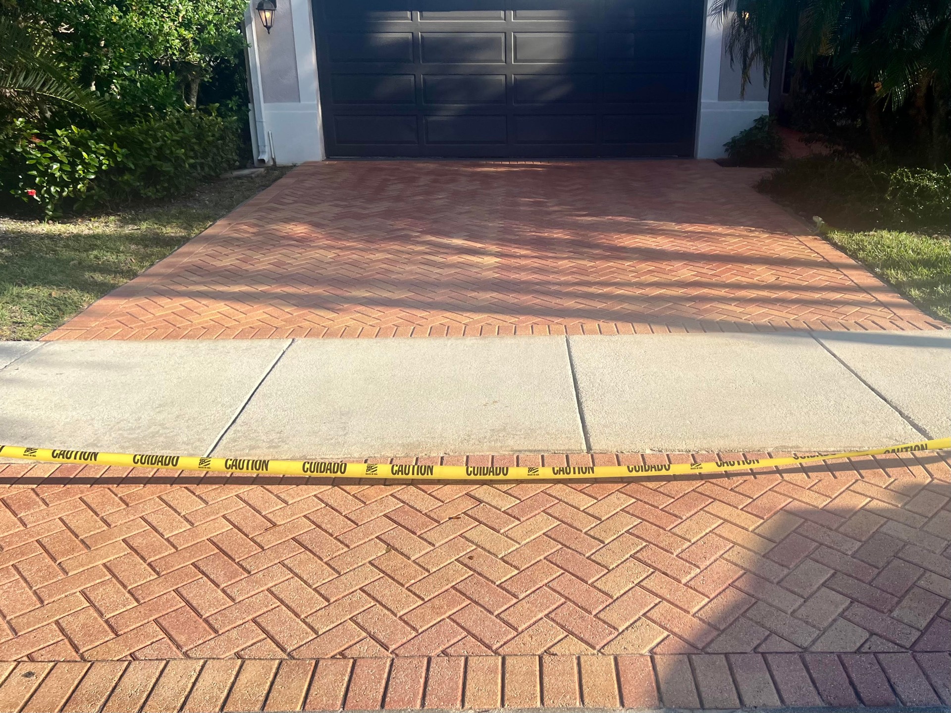 Brick paver driveway restored and sealed by Patty's Sealing — after