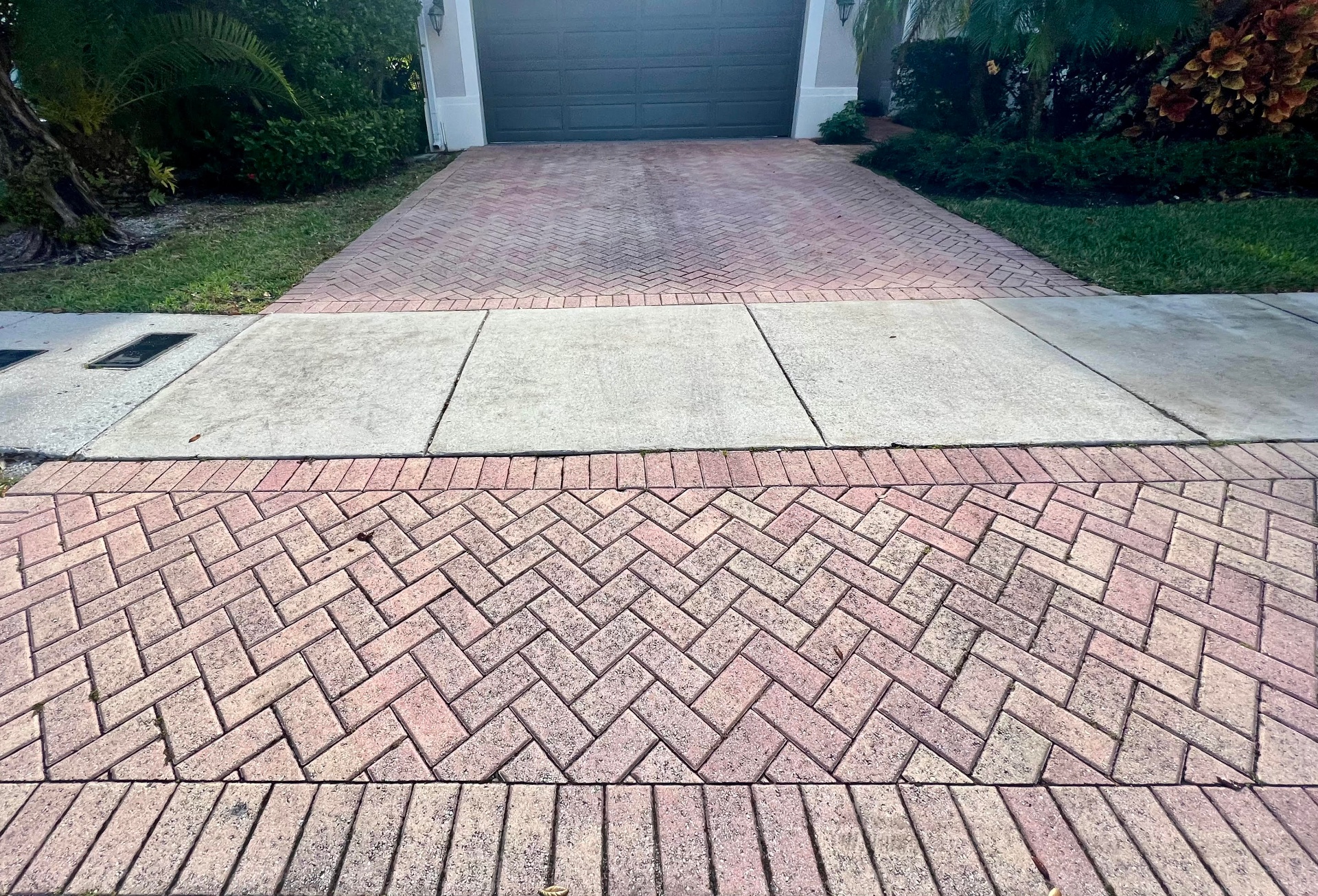 Brick paver driveway restored and sealed by Patty's Sealing — before